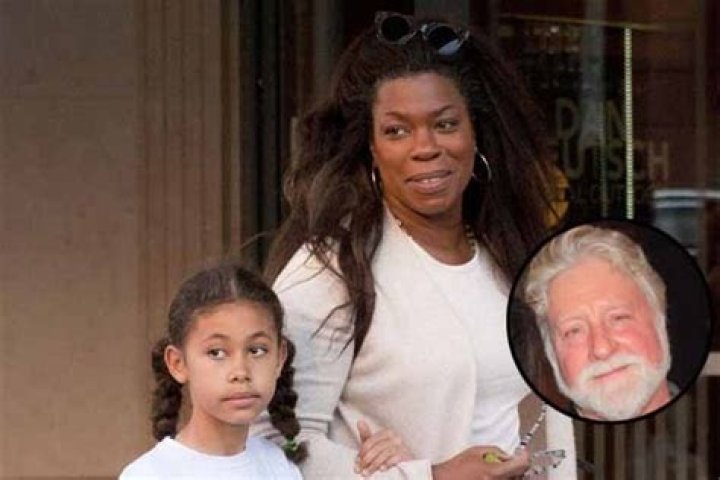 Meet The Enigmatic Woman Behind Michael Tomlinson